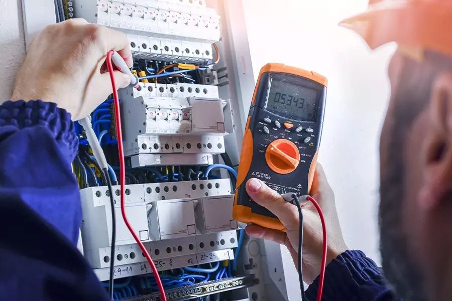 Electrical-Contractor-Insurance-Electrician-Installing-Electric-Cable-Wires-in-a-Fuse-Switch-Box